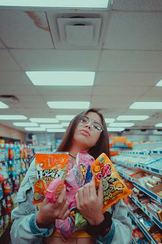 grocery store woman carrying assorted candies market